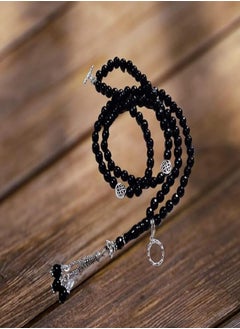 Black rosary with 99 beads made of gemstones with pendants.