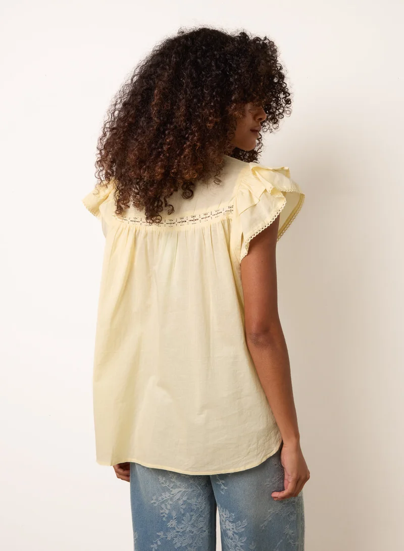 بلو فانيلا Cotton Embroidery Detail Ruffle Sleeve Top