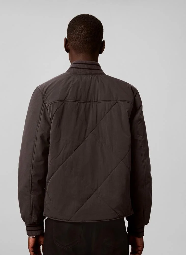 Calvin Klein Jeans  Material Mix Varsity Bomber Jacket for Men | Best Price UAE