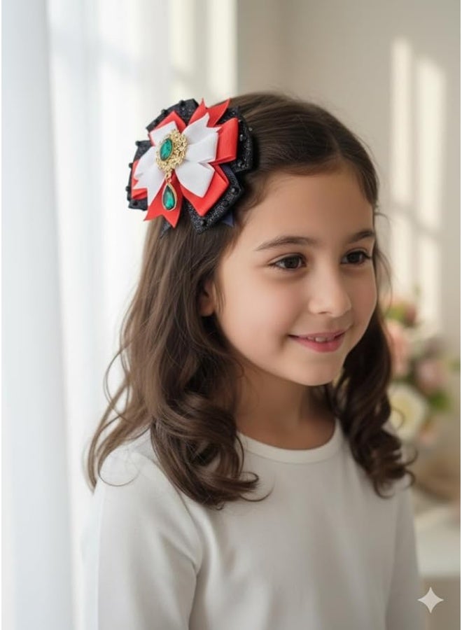 داديز أنجل مشبك شعر لليوم الوطني لدولة الإمارات العربية المتحدة - فيونكة من شرائط حمراء وبيضاء وسوداء وأخضر مع قطعة مركزية من الأحجار الكريمة - Image 3