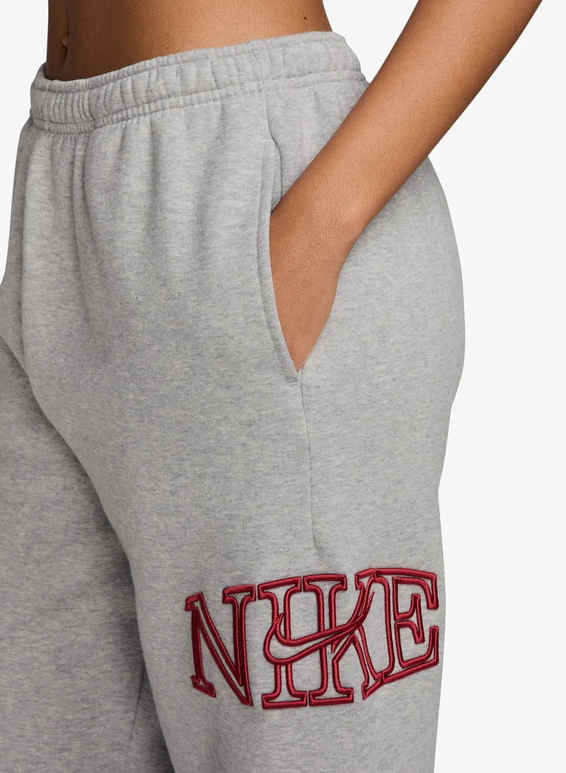 Nike WOLF GREY/HTR/(TOUGH RED) Studio Fleece Mid-Waist Logo Cuffed Sweatpants for Women | Best Price UAE