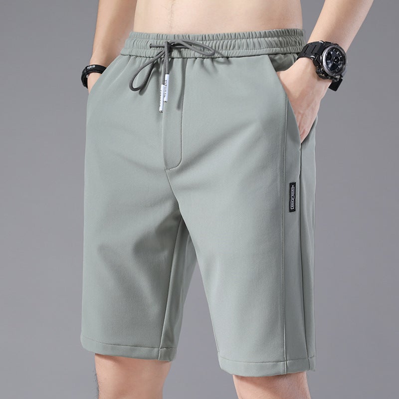 Ice Silk Shorts Mens 2023 Summer New Korean Style Loosen Stretch Stitching Labeling Beach Five-point Pants Light green - Image 1