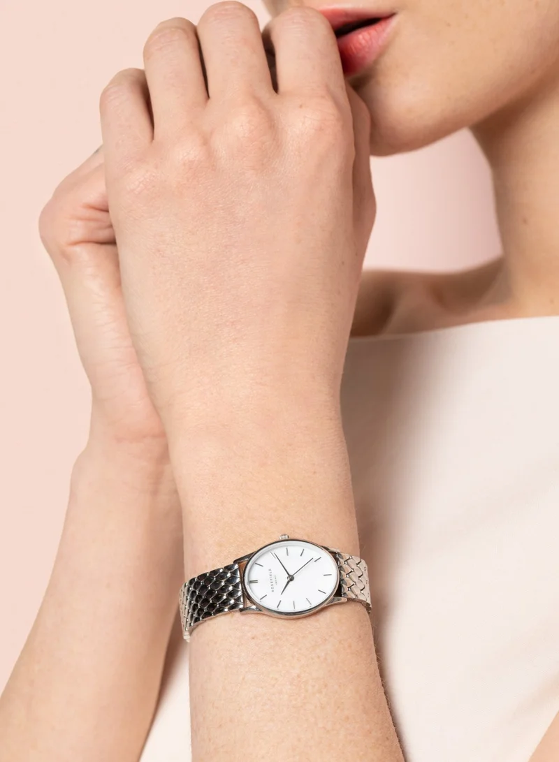 روزفيلد ساعة أوفال أنالوج بيضاوية للنساء بميناء أبيض من عرق اللؤلؤ وسوار فولاذي فضي