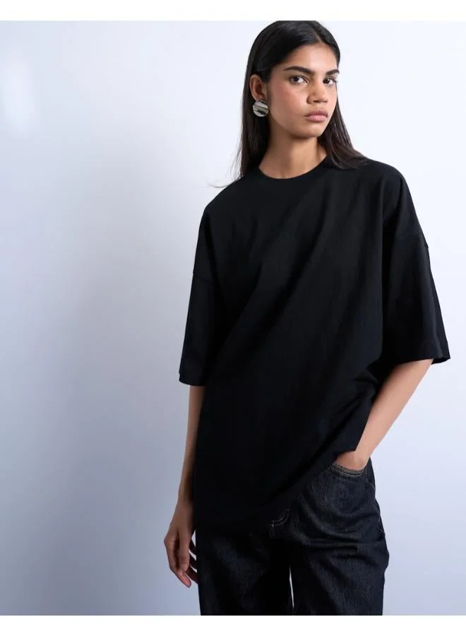 توب شوب تيشيرت واسع بكتف ساقط