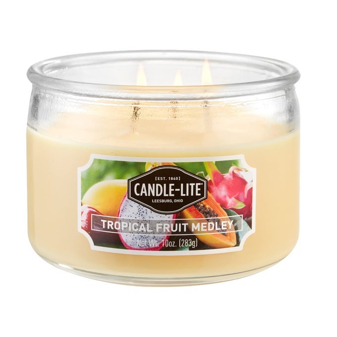 SCENTED CANDLES TROPICAL FRUIT MEDLEY FRAGRANCE ONE 10 OZ THREE WICK AROMATHERAPY CANDLE WITH 2040 HOURS OF BURN TIME YELLOW COLOR