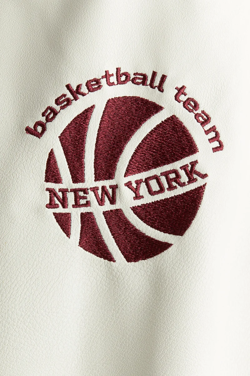 اتش اند ام جاكيت بيسبول مزين بنقشة