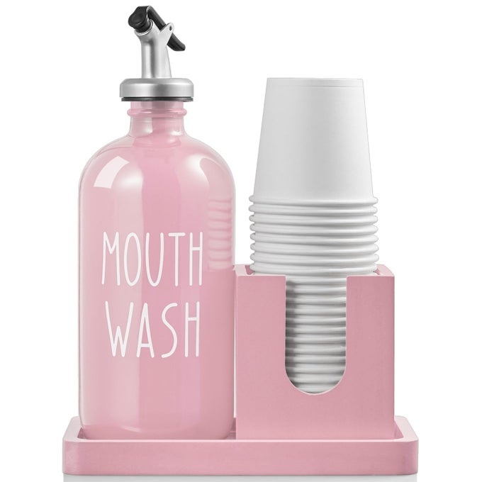 GLASS MOUTHWASH DISPENSER FOR BATHROOM 16 OZ MOUTHWASH DISPENSER WITH POUR SPOUT AND WOOD CUP HOLDER AND TRAY MOUTH WASH BOTTLE CONTAINER FARMHOUSE KITCHEN BATHROOM DECOR AND ACCESSORIES PINK