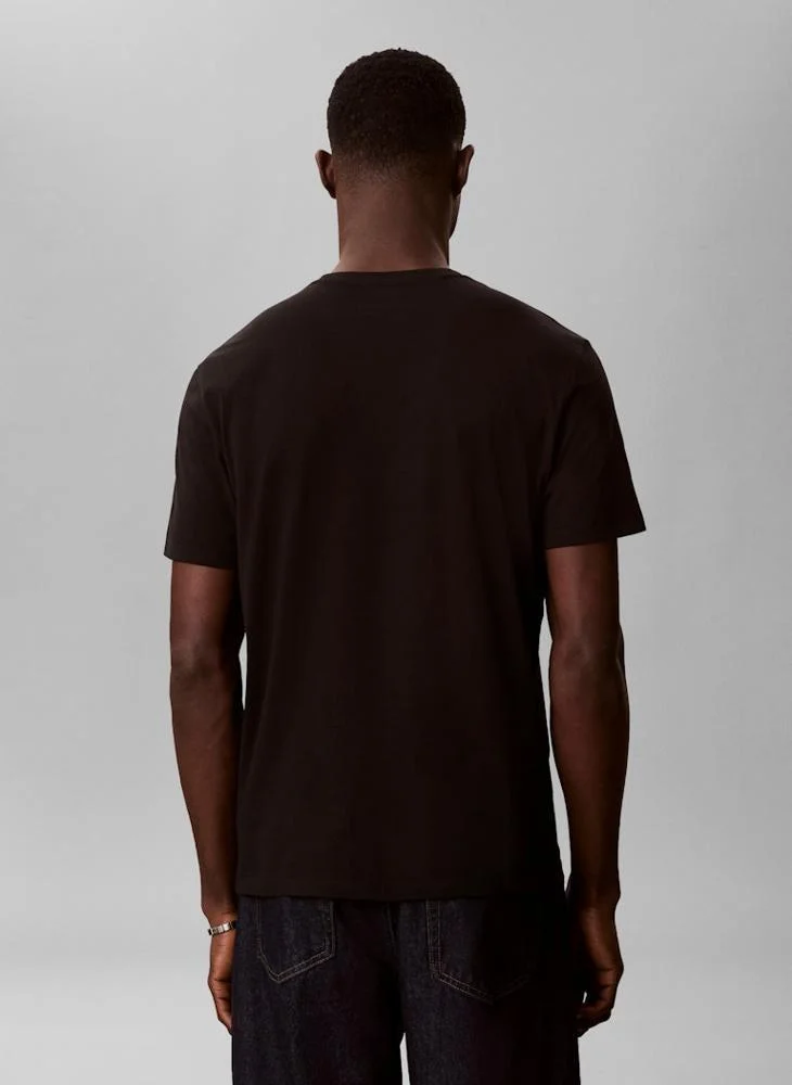 Calvin Klein Jeans  1968 Logo Graphic Crew Neck T-Shirt for Men | Best Price UAE