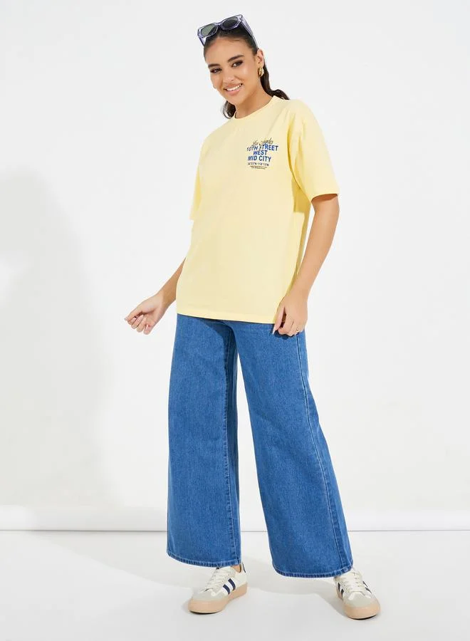 Styli Styli Oversized 10th Street Slogan Print T-Shirt with Dropped Shoulder