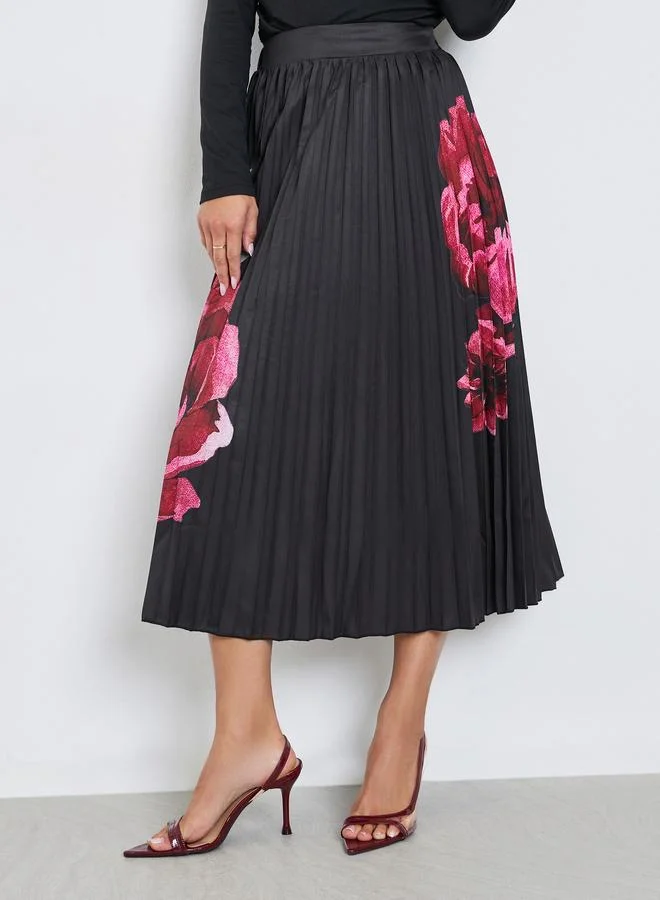 ستايلي تنورة ميدي بطبعة زهور وكسرات