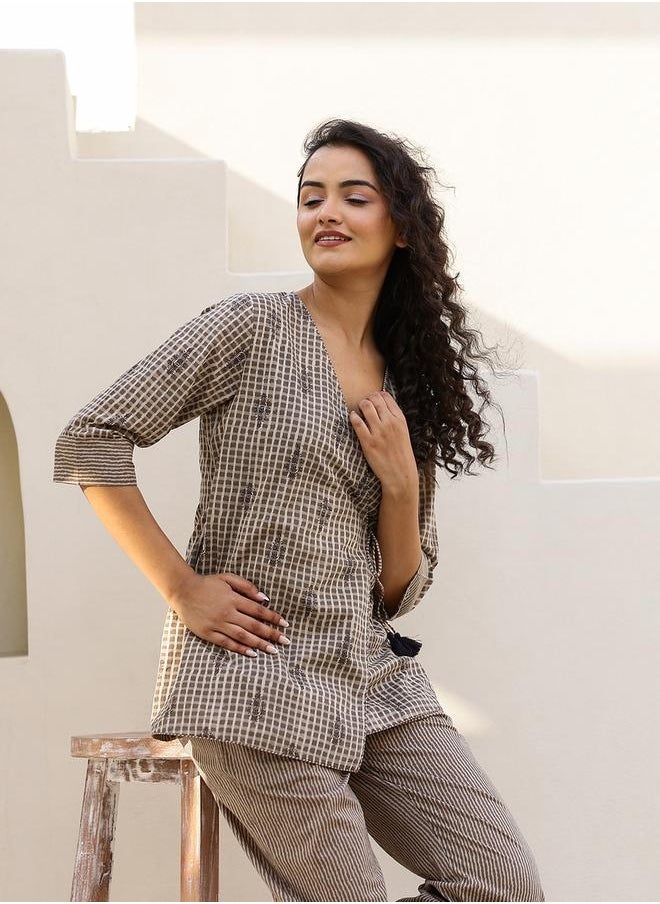 sanskrutihomes All-Over Print Wrap Top with Striped Trousers Co-Ords by Styli  - Image 5