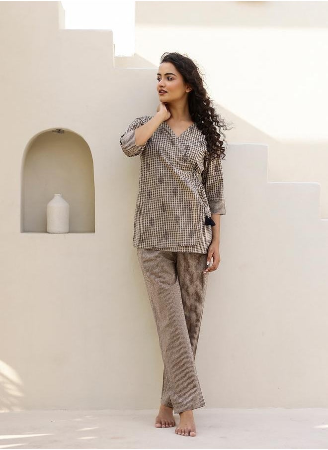 sanskrutihomes All-Over Print Wrap Top with Striped Trousers Co-Ords by Styli  - Image 2