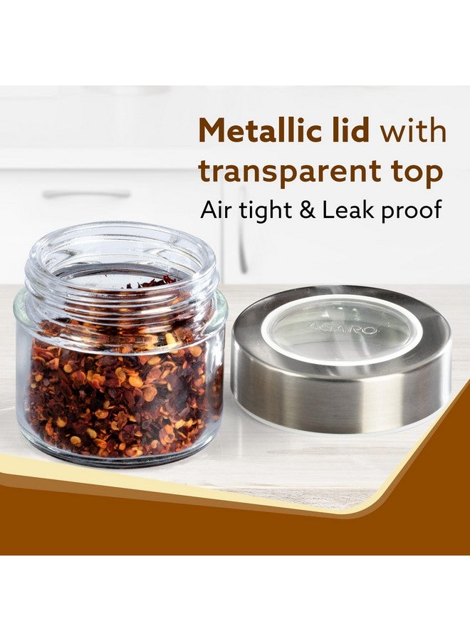 AGARO جرار توابل زجاجية أنيقة من AGARO مع حامل معدني، عبوة من 4، سعة 100 مل لكل واحدة، صندوق تخزين التوابل، منظم مطبخ، حاويات توابل، صندوق ماسالا للمطبخ، غطاء فولاذي مع بلاستيك شفاف، شفاف - Image 3