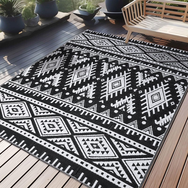 OLANLY Outdoor Rug Waterproof 5x8 ft, Reversible Outdoor Plastic Straw Rug, Boho Patio Rug, Indoor Outdoor Carpet, RV Mat Outside for Patio, Camp, Picnic, Balcony, Deck, Backyard, Black & White - Image 1