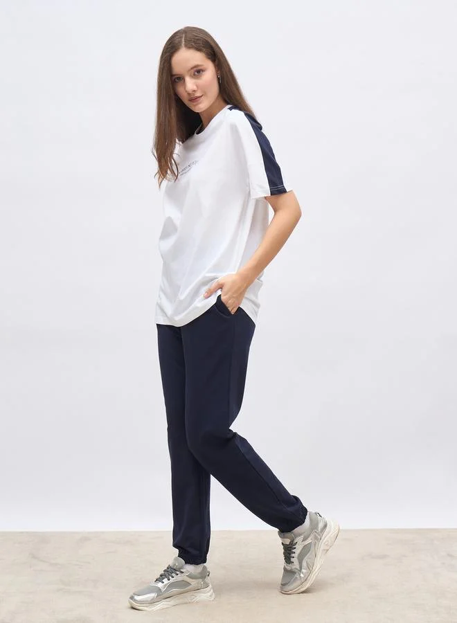 Styli Styli White Oversized Slogan T-Shirt and Cuffed Joggers Set
