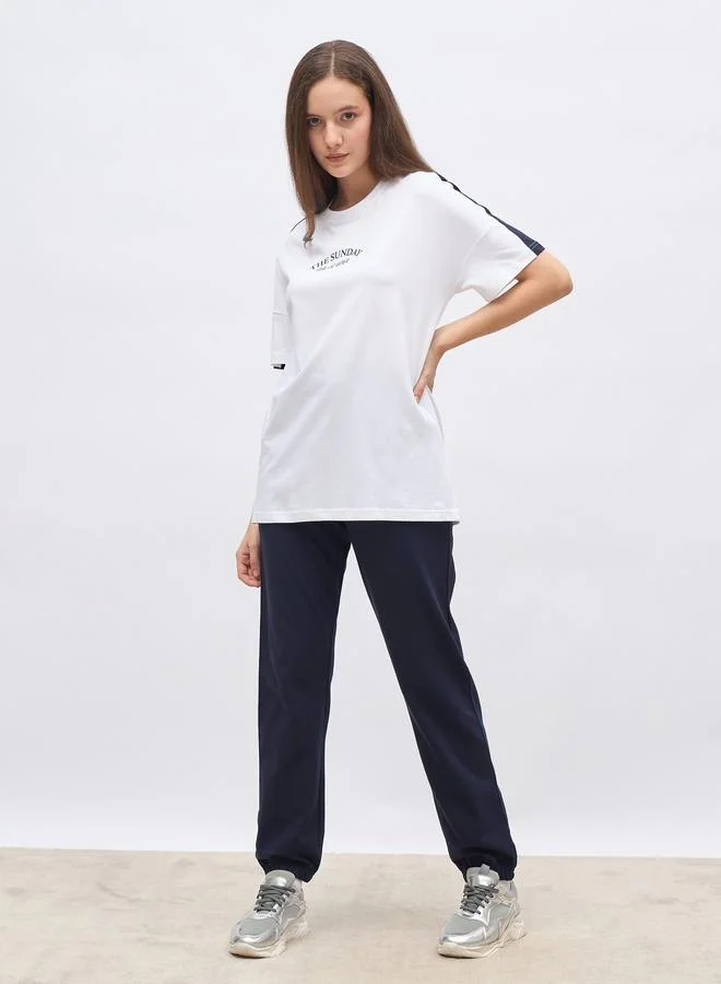 ستايلي Styli White Oversized Slogan T-Shirt and Cuffed Joggers Set