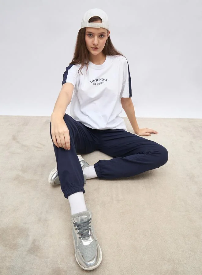 Styli Styli White Oversized Slogan T-Shirt and Cuffed Joggers Set