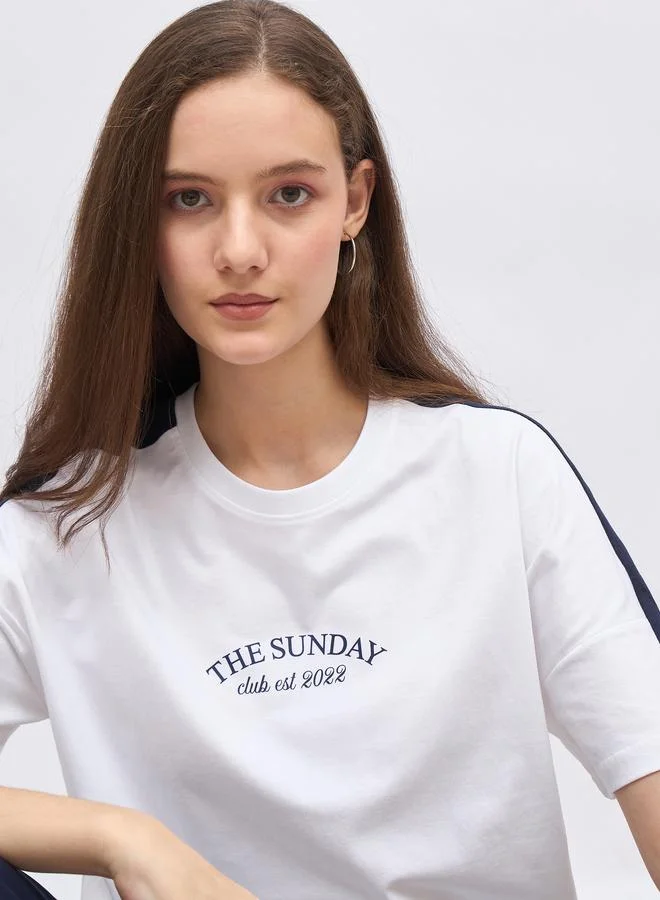 Styli Styli White Oversized Slogan T-Shirt and Cuffed Joggers Set