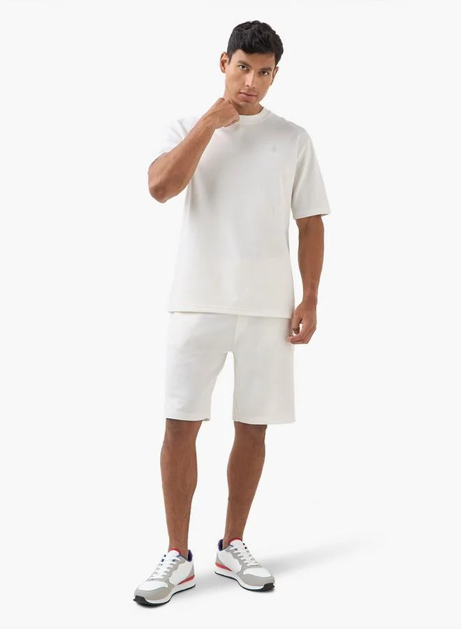 إمبيرور تيشيرت إمبراطور برقبة دائرية بتطريز الشعار