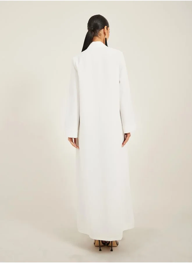 Styli texture fabric front open abaya with high neck detail