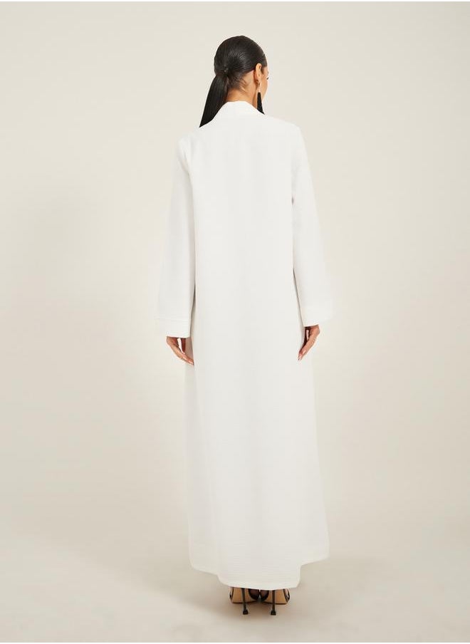 Styli - texture fabric front open abaya with high neck detail - Image 1