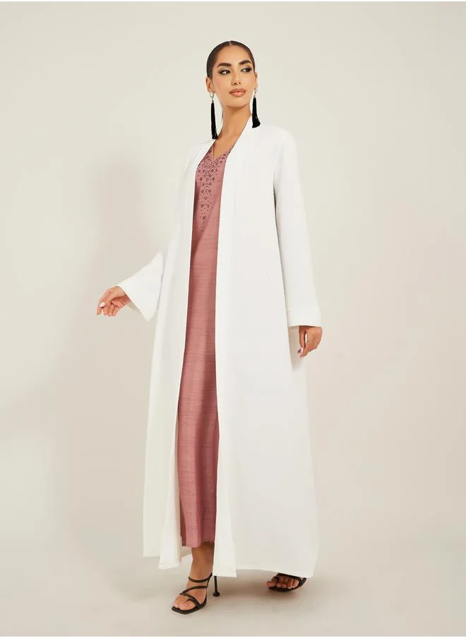 Styli texture fabric front open abaya with high neck detail