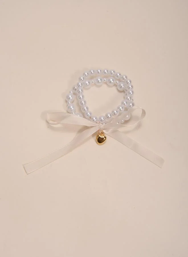 تايك تو Multistrand Faux Pearl Bracelet with Heart and Bow Charms