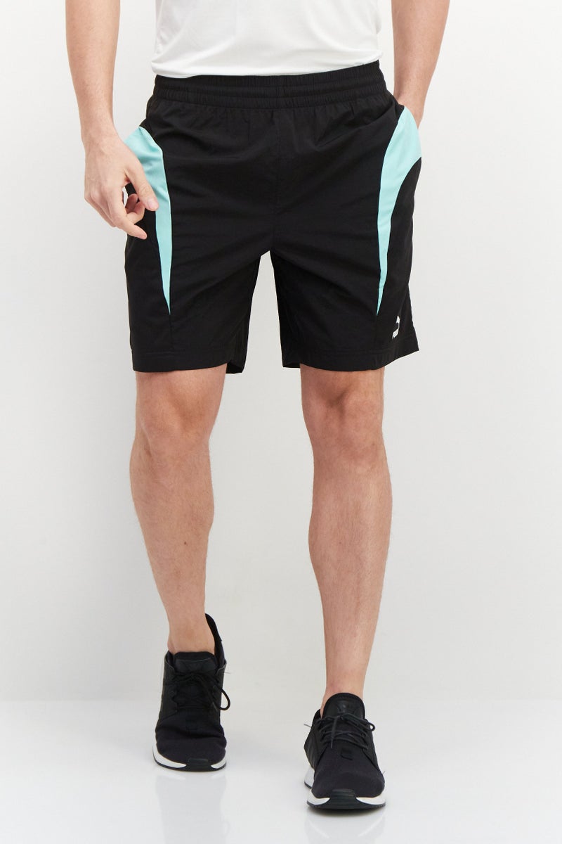 PUMA شورتات تدريبية للرجال بقصة مريحة بشعار العلامة التجارية، أسود - Image 1