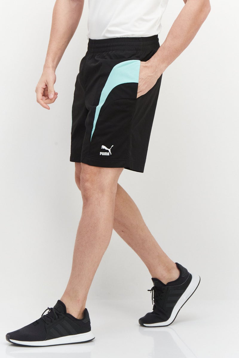 PUMA شورتات تدريبية للرجال بقصة مريحة بشعار العلامة التجارية، أسود - Image 4