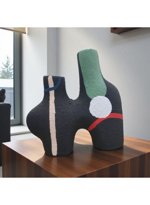 A decorative ceramic vase, perfect for the office and home.