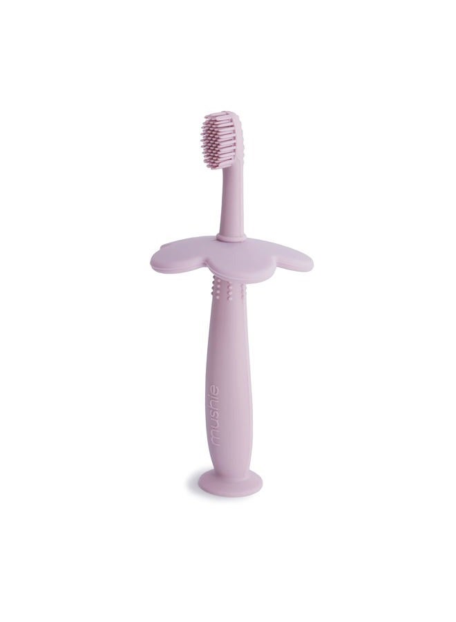 Mushie Flower Training Toothbrush for Toddlers- Gentle Gum Stimulation & Choking Prevention - Soft Silicone Bristles & Suction Base with Removable Safety Guard - Soft Lilac - Image 1