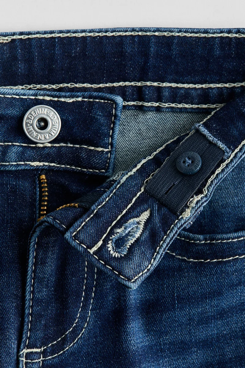 اتش اند ام جينز بخصر منخفض وساق بحافة واسعة