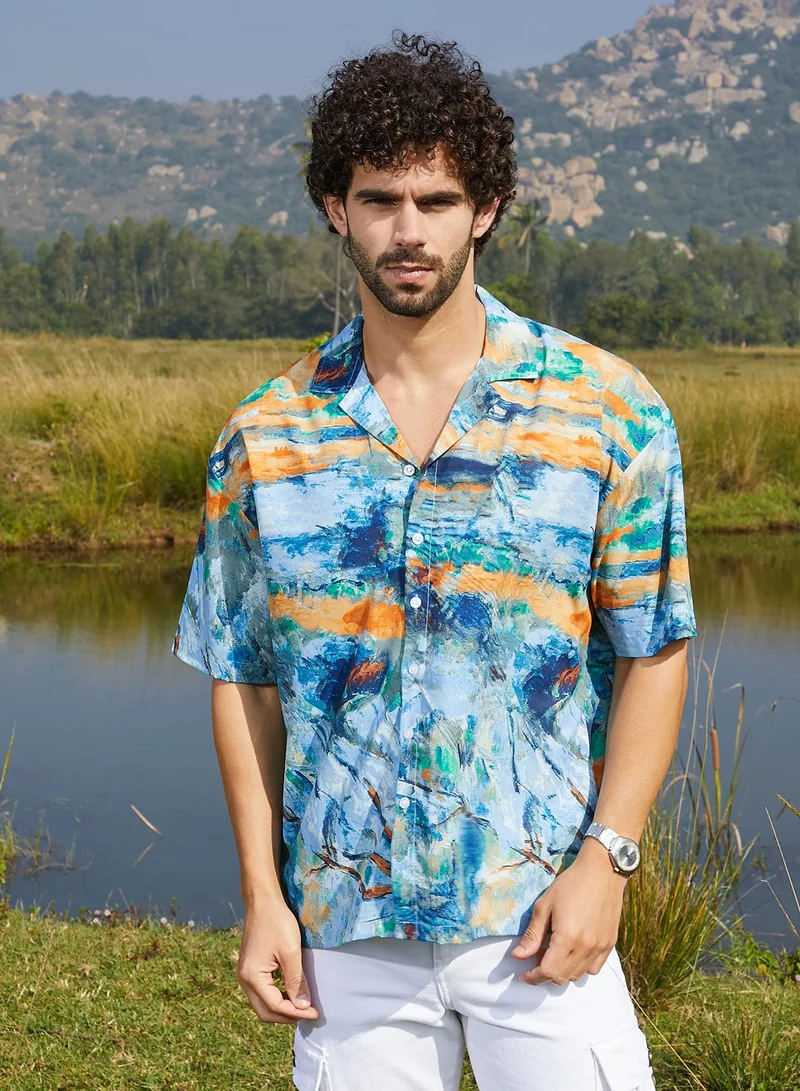 كامبوس سوترا قميص رجالي واسع أزرق وبرتقالي من كامبس سوترا للملابس الكاجوال بياقة كوبانية وأكمام قصيرة مكبلة وإغلاق بأزرار