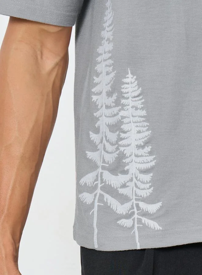 ستايلي تيشيرت مطرز بقصة واسعة