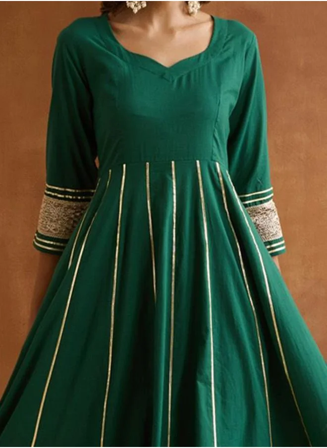 ISHIN Three-Fourth Sleeve Women Green Cotton Kurta Set with Embroidered pattern Tunic and Palazzo features a Round neckline and Three-Fourth Sleeve secured with Elastic closure and styled in Straight Fit ideal for Festive moments — exude elegance in every glance.