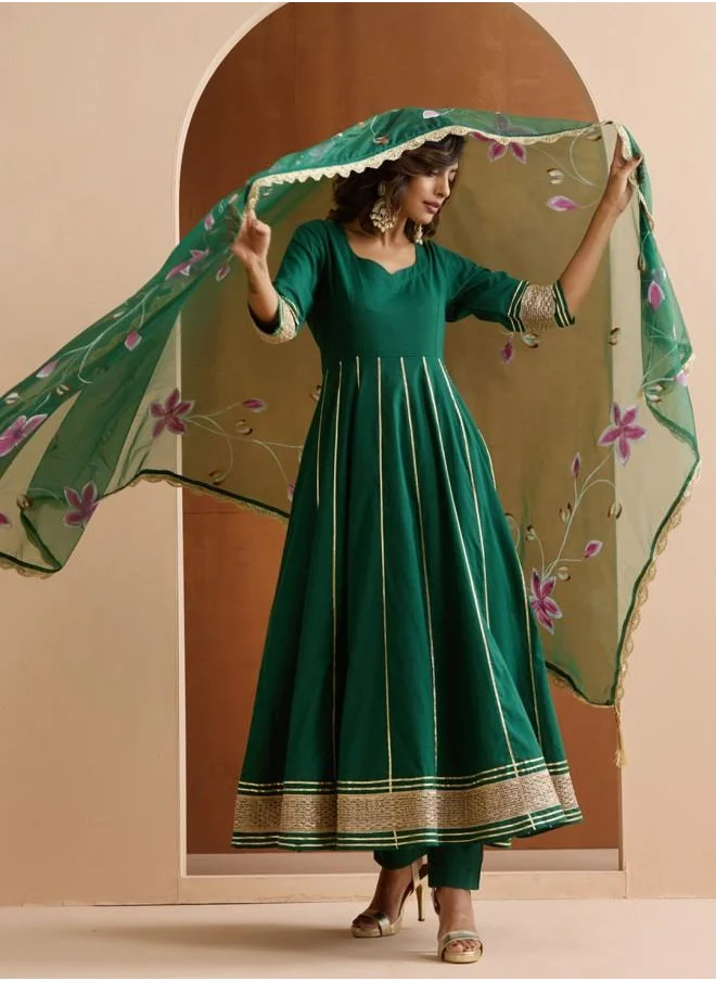 ISHIN Three-Fourth Sleeve Women Green Cotton Kurta Set with Embroidered pattern Tunic and Palazzo features a Round neckline and Three-Fourth Sleeve secured with Elastic closure and styled in Straight Fit ideal for Festive moments — exude elegance in every glance.