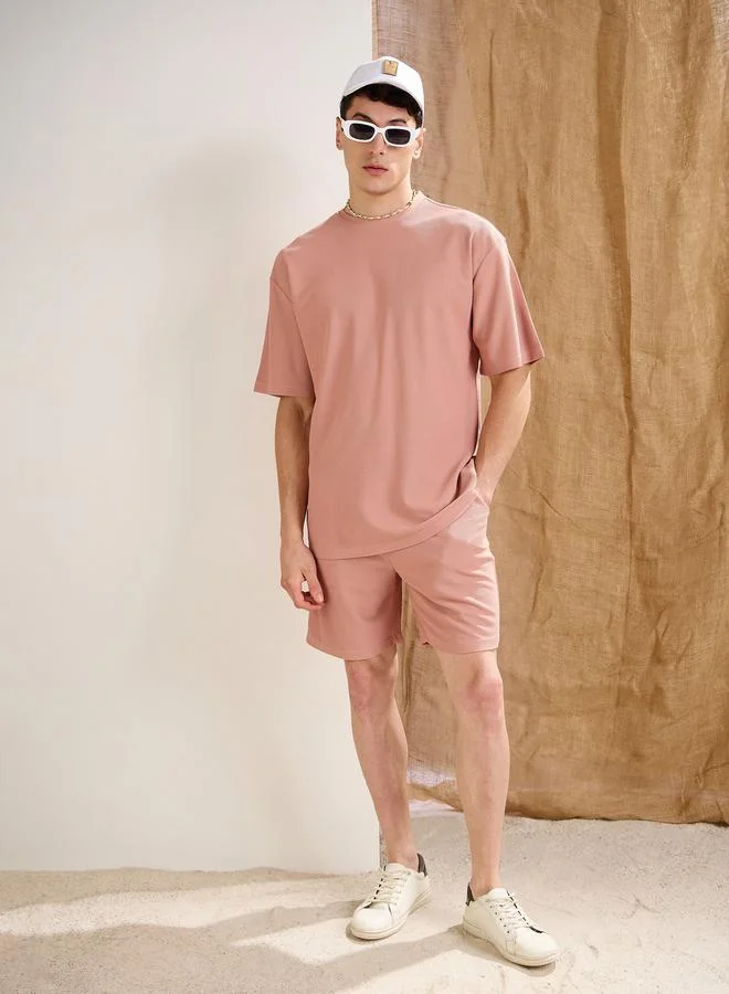 SASSAFRAS Sassafras Men Pink Waffle Textured Oversized T-Shirt and Shorts Co-Ords