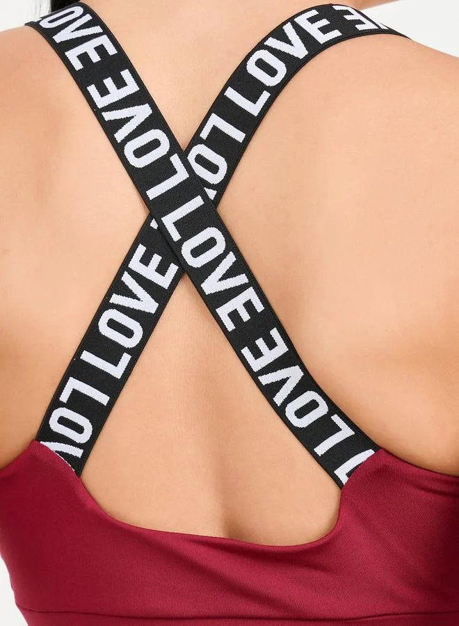 Styli Active Pack of 3 - Solid Top- Slogan Print Strap Sports Bra and Leggings