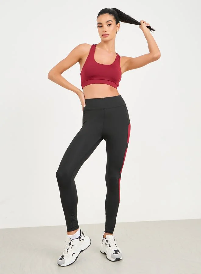 Styli Active Pack of 3 - Solid Top- Slogan Print Strap Sports Bra and Leggings