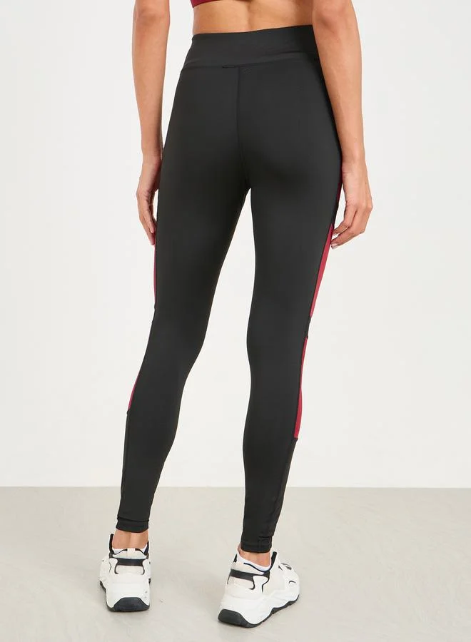 Styli Active Pack of 3 - Solid Top- Slogan Print Strap Sports Bra and Leggings