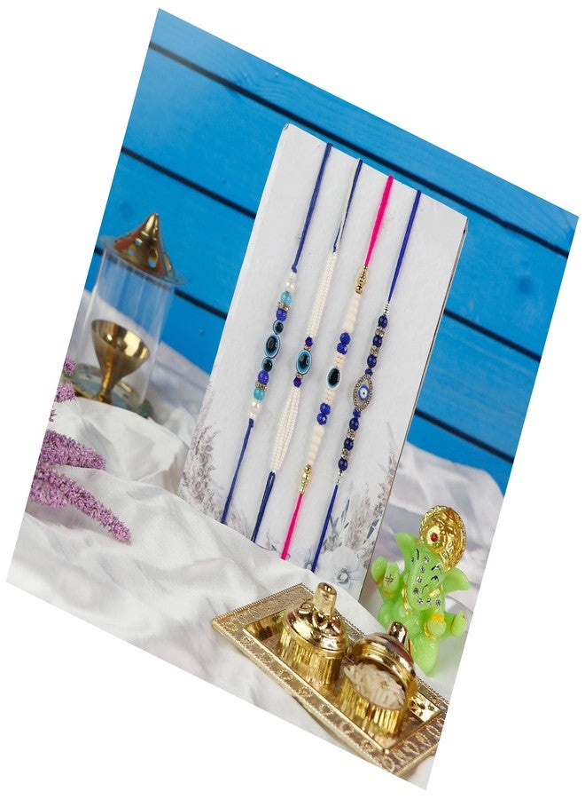 Toris Pack of 4 Evil eye Rakhi Set Comes with Tilak set, Greeting card in Elegant Blue Shade – Thoughtful Rakhi Gift with Traditional Charm and Style - Image 1