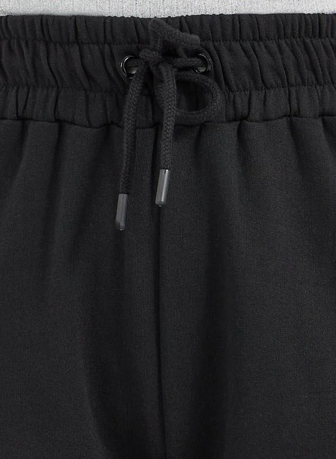 Styli Styli Solid Drawstring Waist Flared Joggers