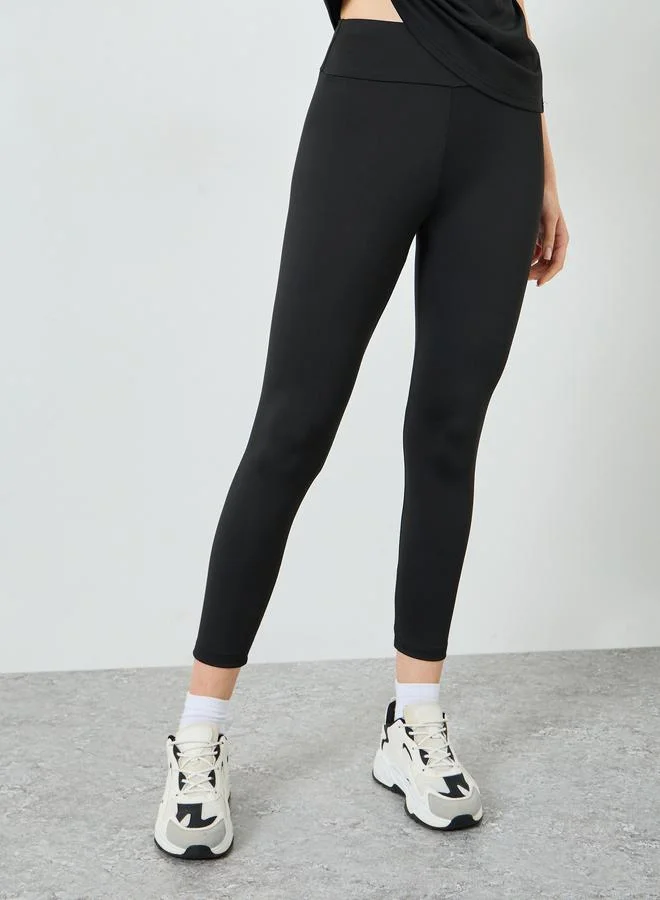 Styli Active  Back Text Strap Short Sleeves Top and Cari Set for Women | Best Price UAE