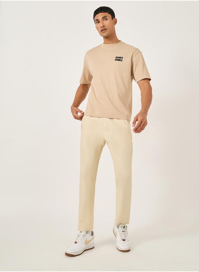 Fort Collins Men Beige Solid Straight Leg Pants with Drawstring Waist  - Image 1
