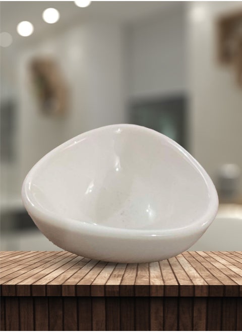 A small, deep, oval, white hospitality plate, suitable for serving at events and parties, and suitable for family and friends in an elegant way.