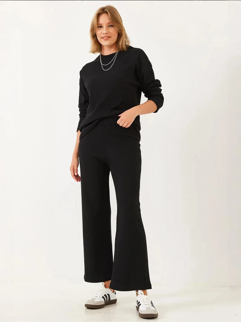 بيانكو لوتشي طقم سترة وسروال بياقة دائرية بنقش مضلع من لوكسي