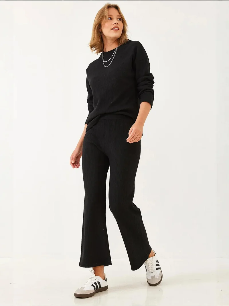 بيانكو لوتشي طقم سترة وسروال بياقة دائرية بنقش مضلع من لوكسي