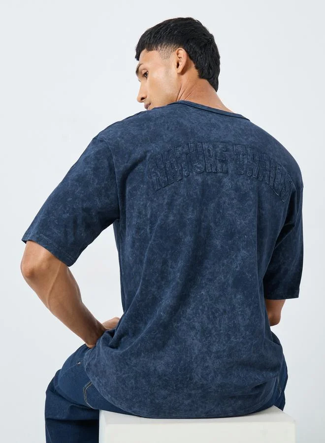 ستايلي تيشيرت جيرسي مغسول بحمض مع تفاصيل أبليك