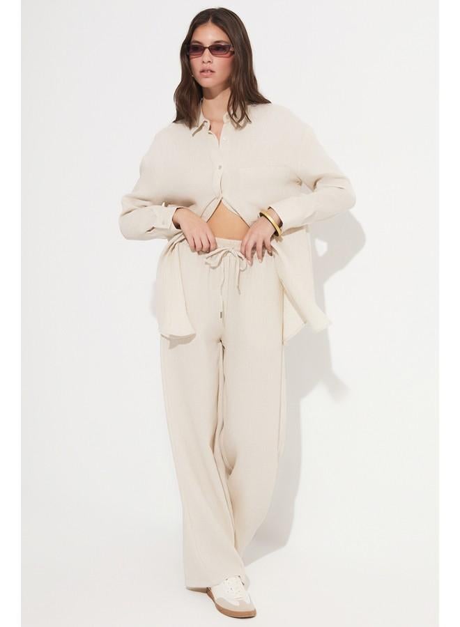 جون بنطلون نسائي واسع الساق بخصر مطاطي من فيسكوز - حصري يونيو - حجر - Image 1