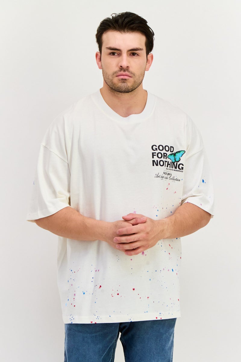 GOOD FOR NOTHING تي شيرت رجالي بأكمام قصيرة وياقة دائرية، مطبوع برسومات، لون أبيض فاتح - Image 1